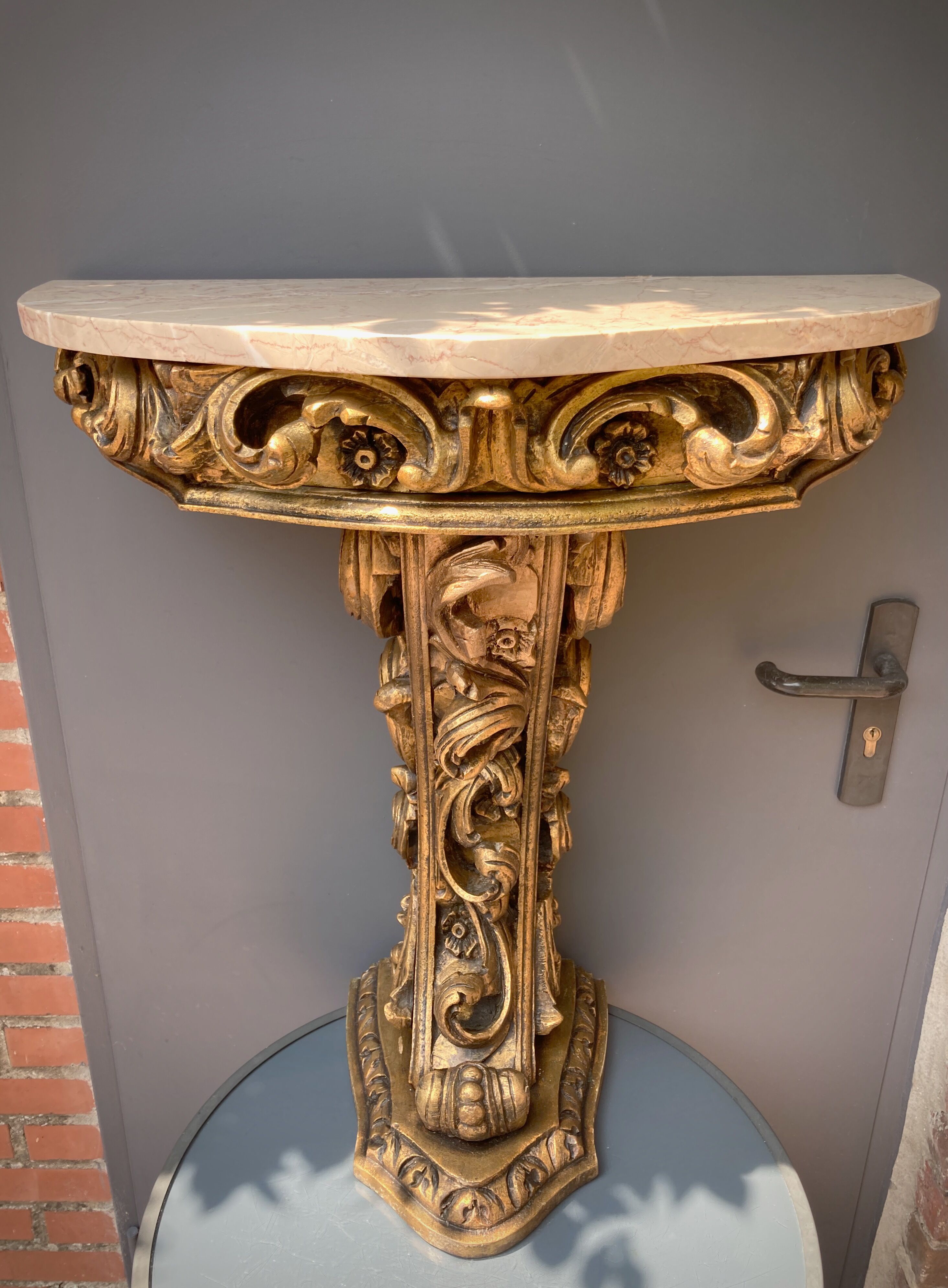 Carved wooden and marble console
