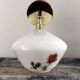 Applique murale dorée inclinable globe fleuri
