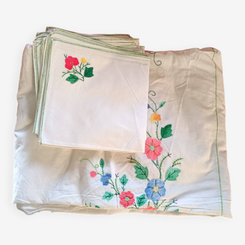 Large white map with colored flower insertion and embroidery.