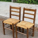 2 solid wood and straw chairs