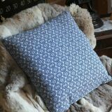 Blue cushion with royal pattern