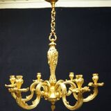 Massive bronze chandelier for candles.