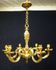 Massive bronze chandelier for candles.