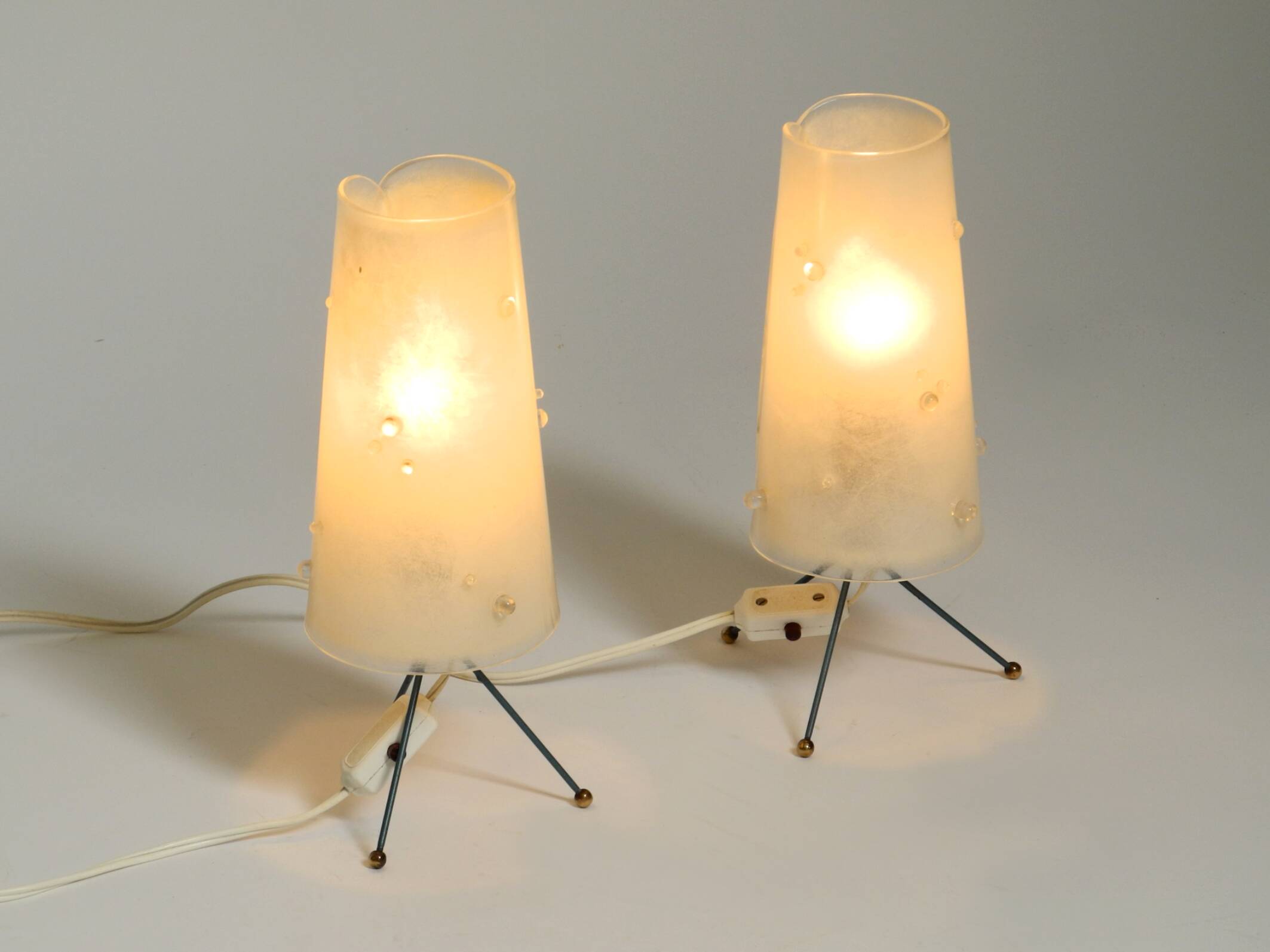 Two very Mid Century Modern tripod table lamps with white plexiglas shades