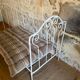 Small renovated wrought iron bed
