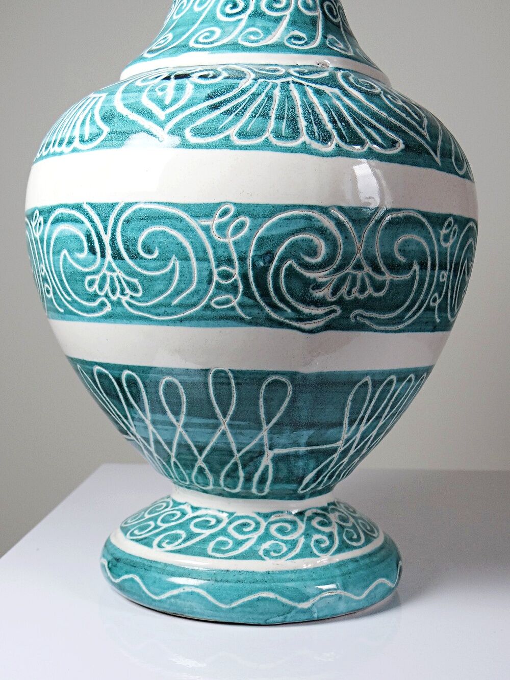 Vintage turquoise ceramic baluster vase with incised decoration.