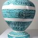 Vintage turquoise ceramic baluster vase with incised decoration.