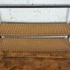 low metal and rattan shelf from the 50s