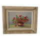 Painting red wild flowers in a vase.