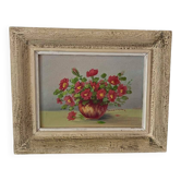 Painting red wild flowers in a vase.