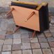 Pair of vintage 60s armchairs in black imitation leather and mustard toffee