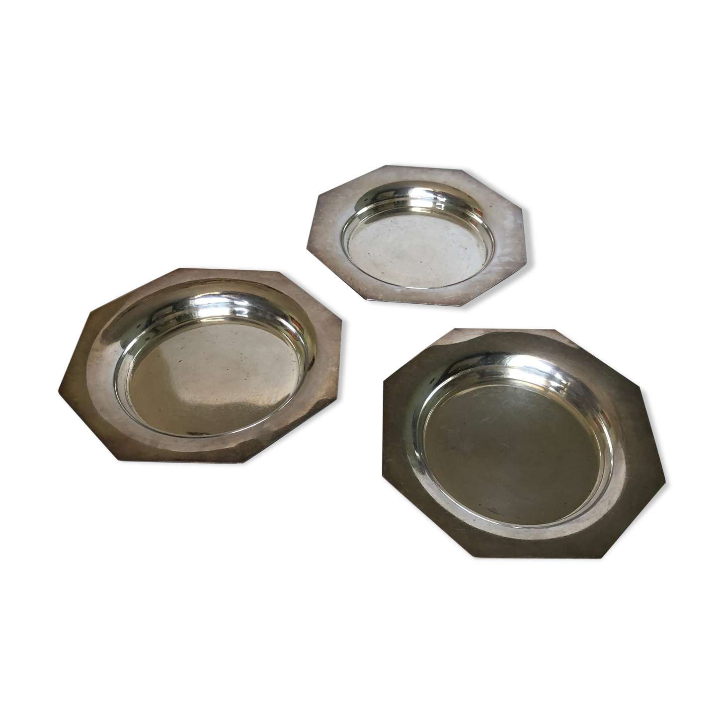 Set of three silver metal bottle bottoms