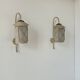 Pair of vintage wall lights in perforated metal, brass, and perspex, France, 1950.