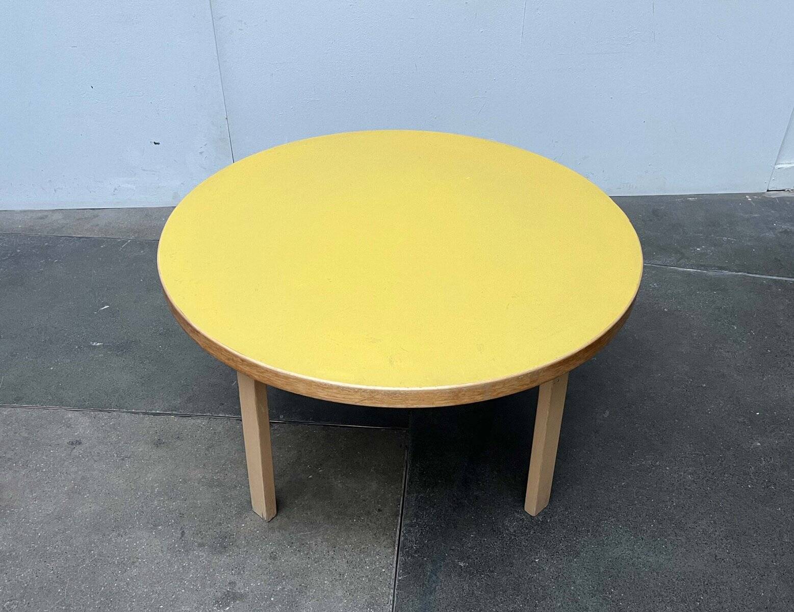 Mid-century modern yellow linoleum coffee table by Alva Aalto for Artek, Finland, 1960s.