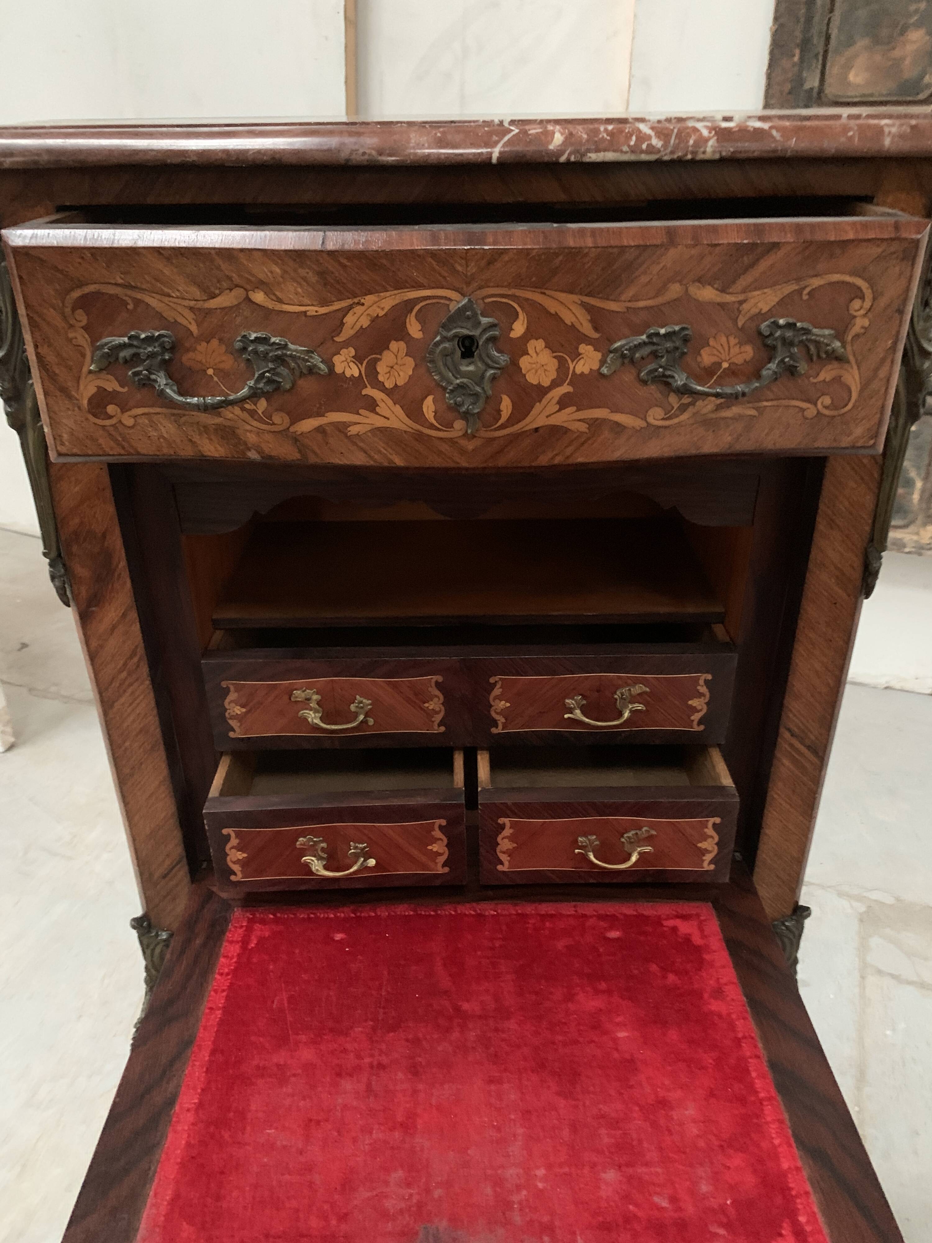 Louis XV style lady's secretary in light wood marquetry, 20th century.