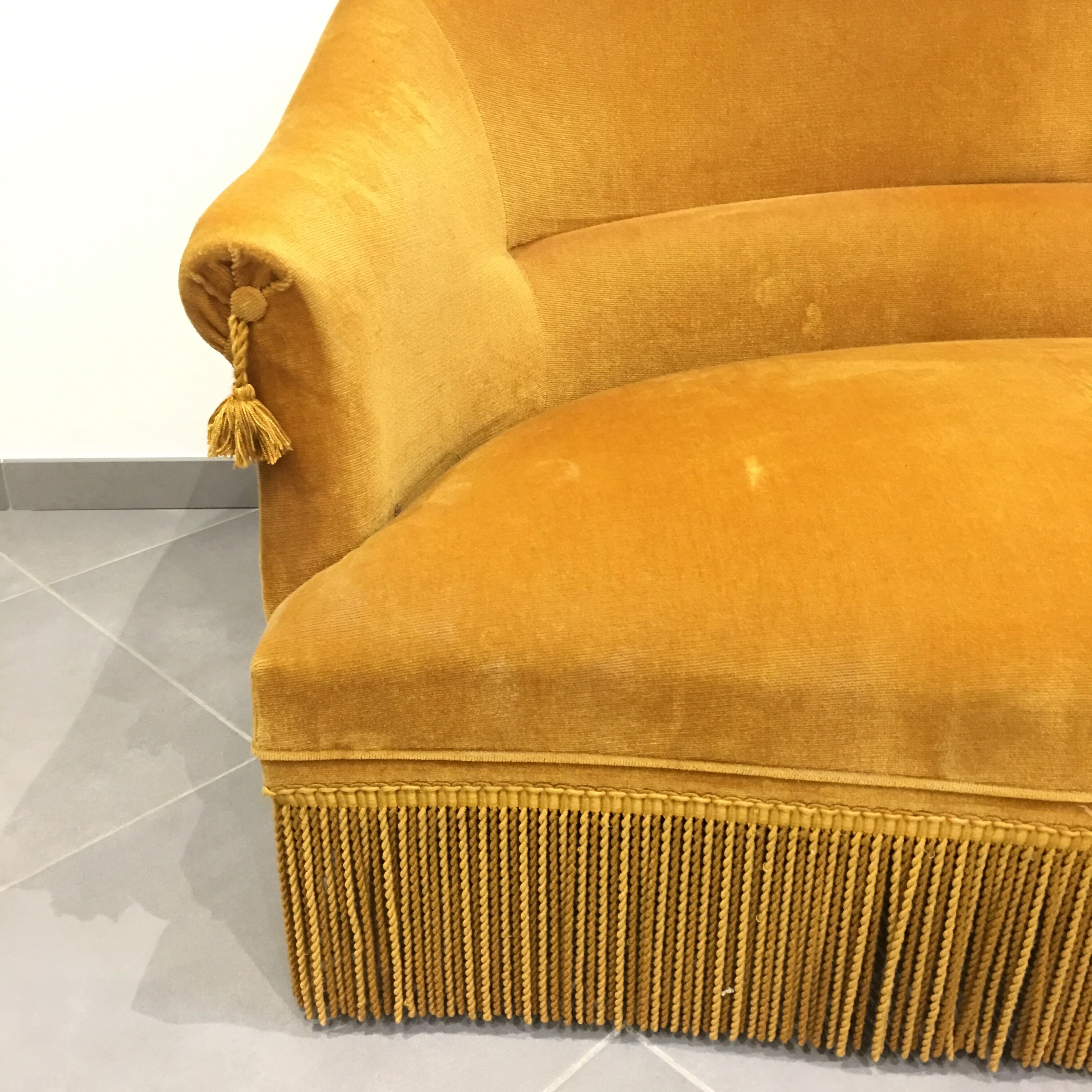 Velvet fringed sofa