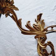 Pair of vintage French wall sconces in bronze, Louis XV Rococo style.