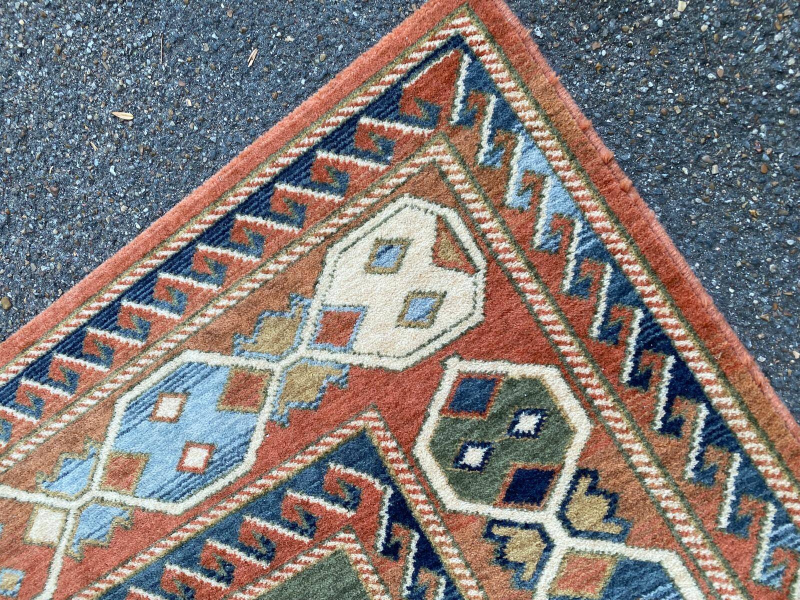 Large oriental wool rug with terracotta geometric patterns 200x300cm