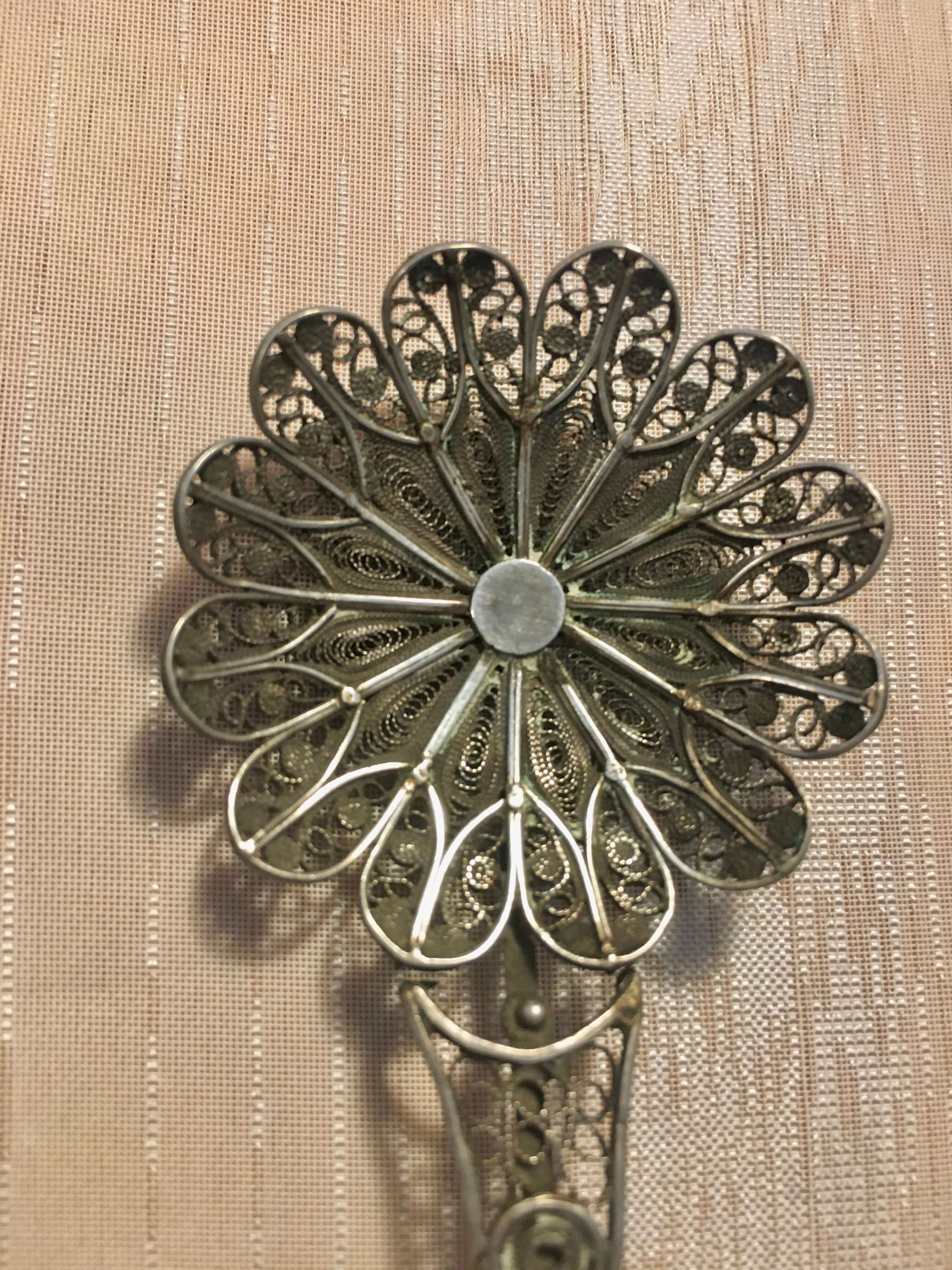 silver sprinkler spoon
