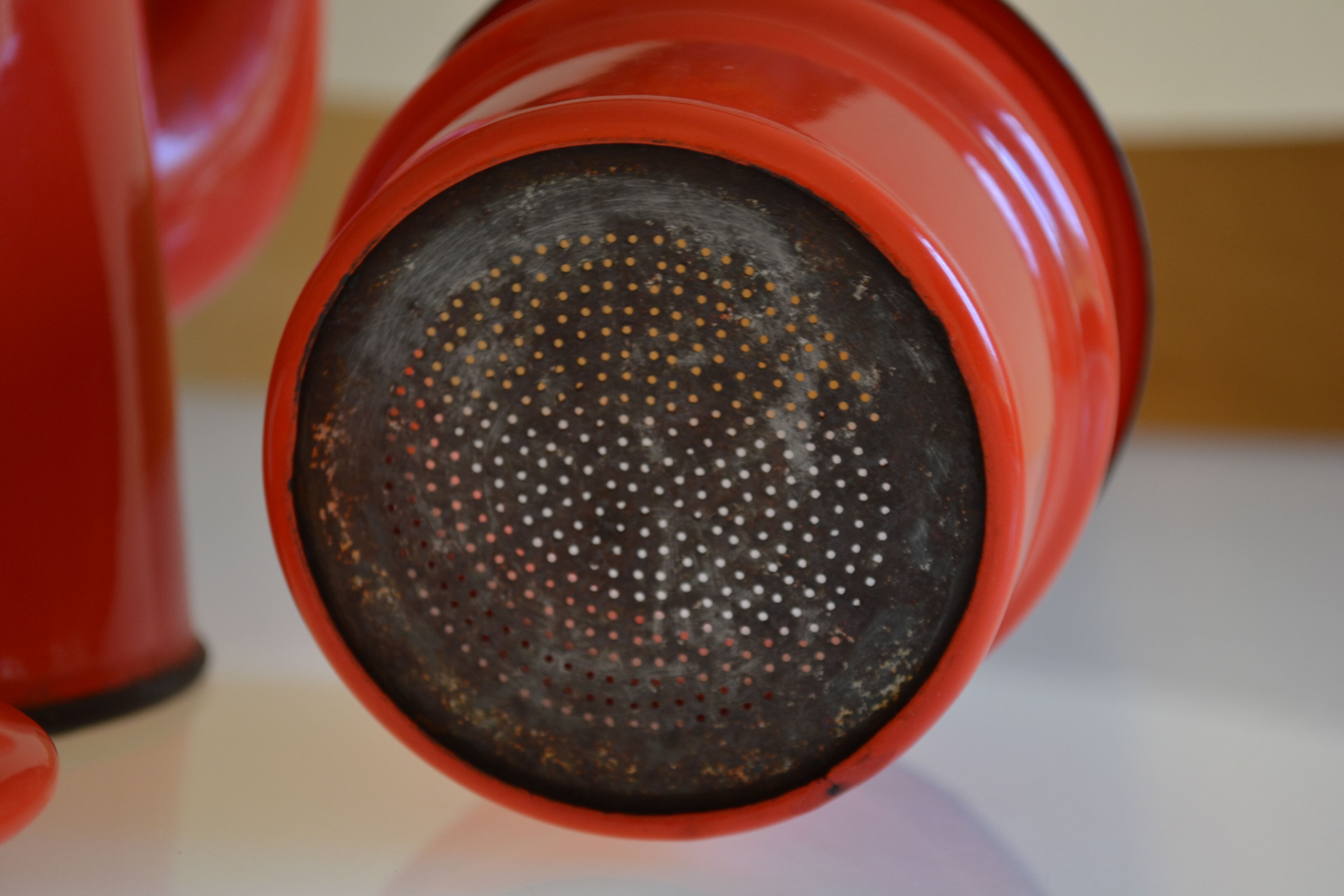 Vintage coffee maker in red and black enamelled sheet