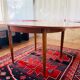 Expandable teak dining table, butterfly extension, circa 60s