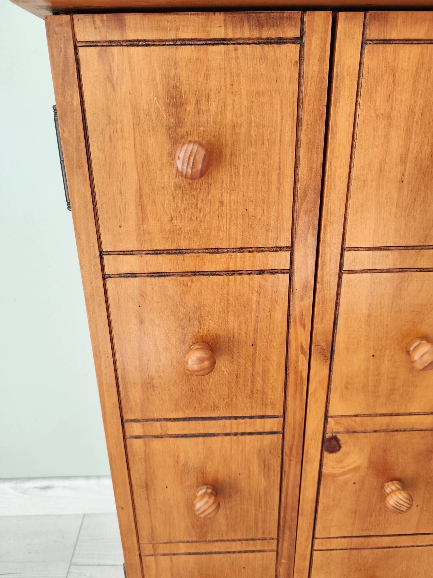 Small wooden piece of furniture, cabinet style, false drawers.