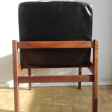 Massive teak and black skai armchair from the 1960s