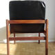 Massive teak and black skai armchair from the 1960s