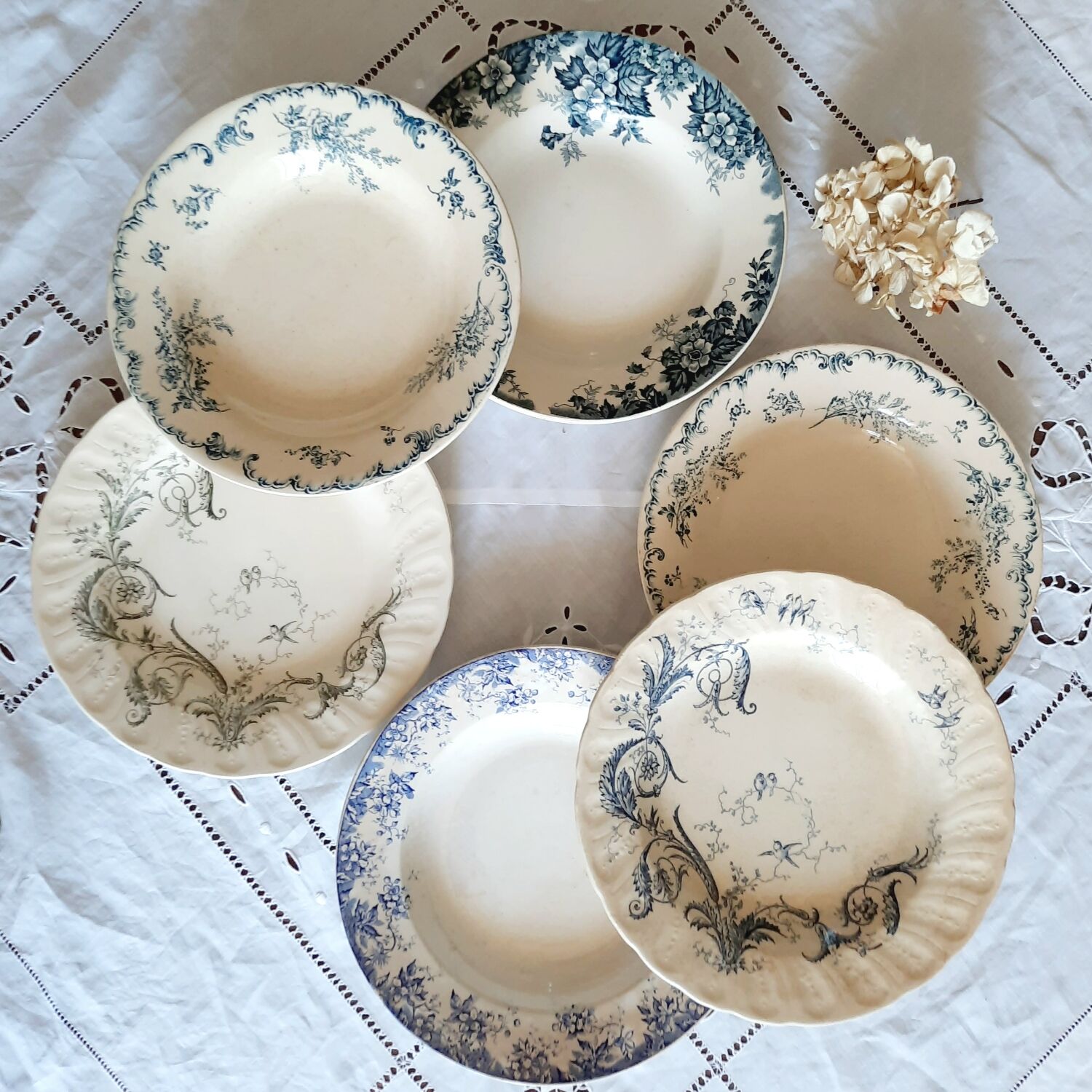 Old mismatched hollow plates in iron earth earthenware