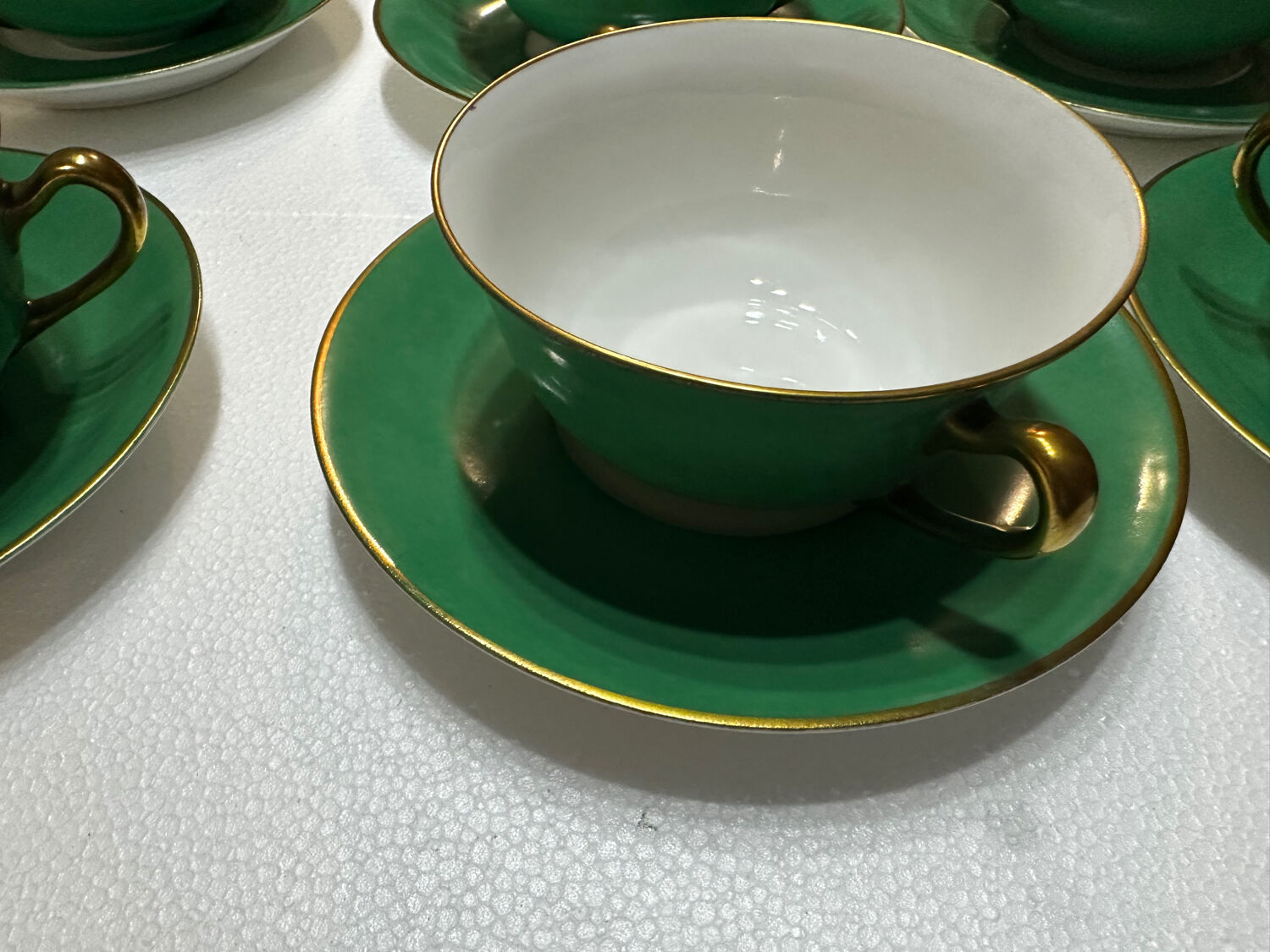 Service 14 cup and saucer in Art Deco Emerald Green and Gold.