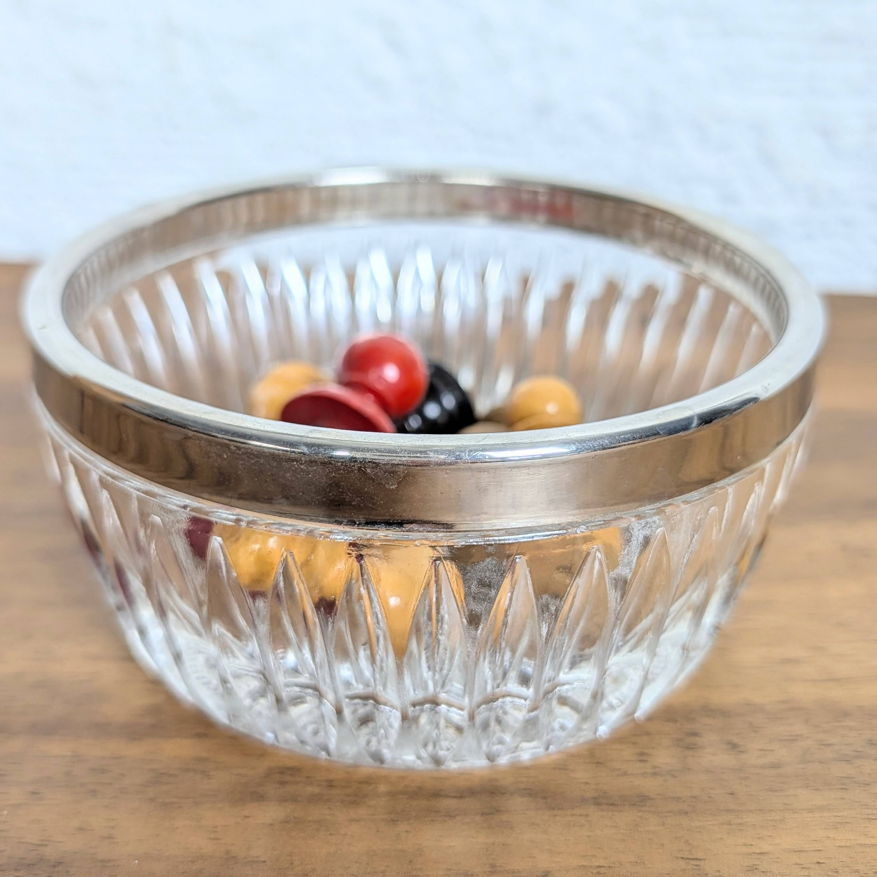 Cut glass bowl with silver-plated edge