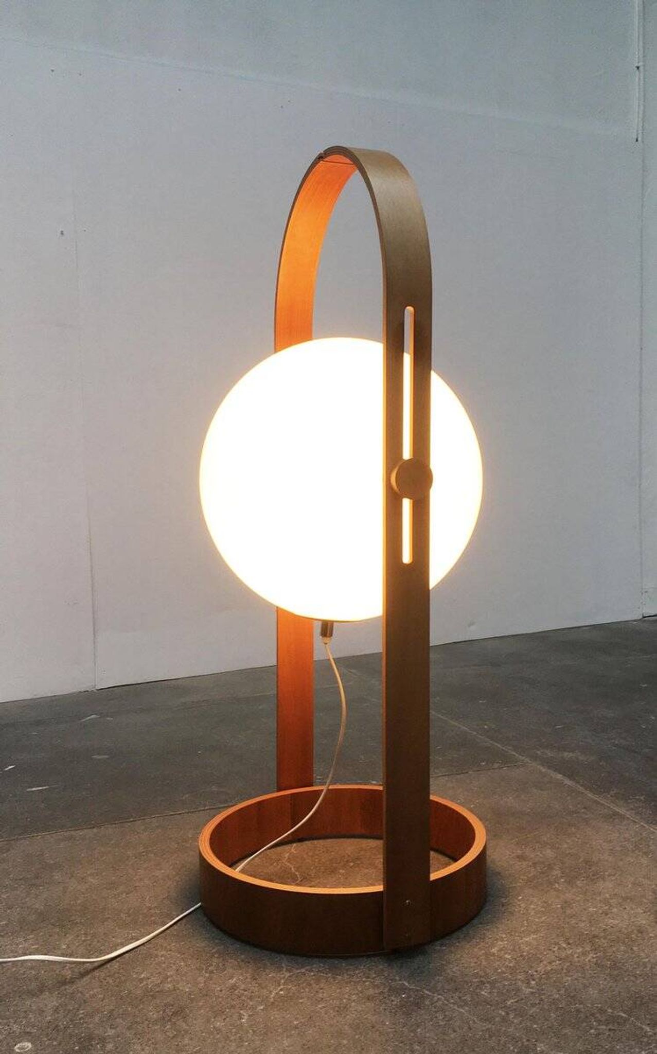 Swiss space-style floor lamp made of plastic and plywood from the 1960s.