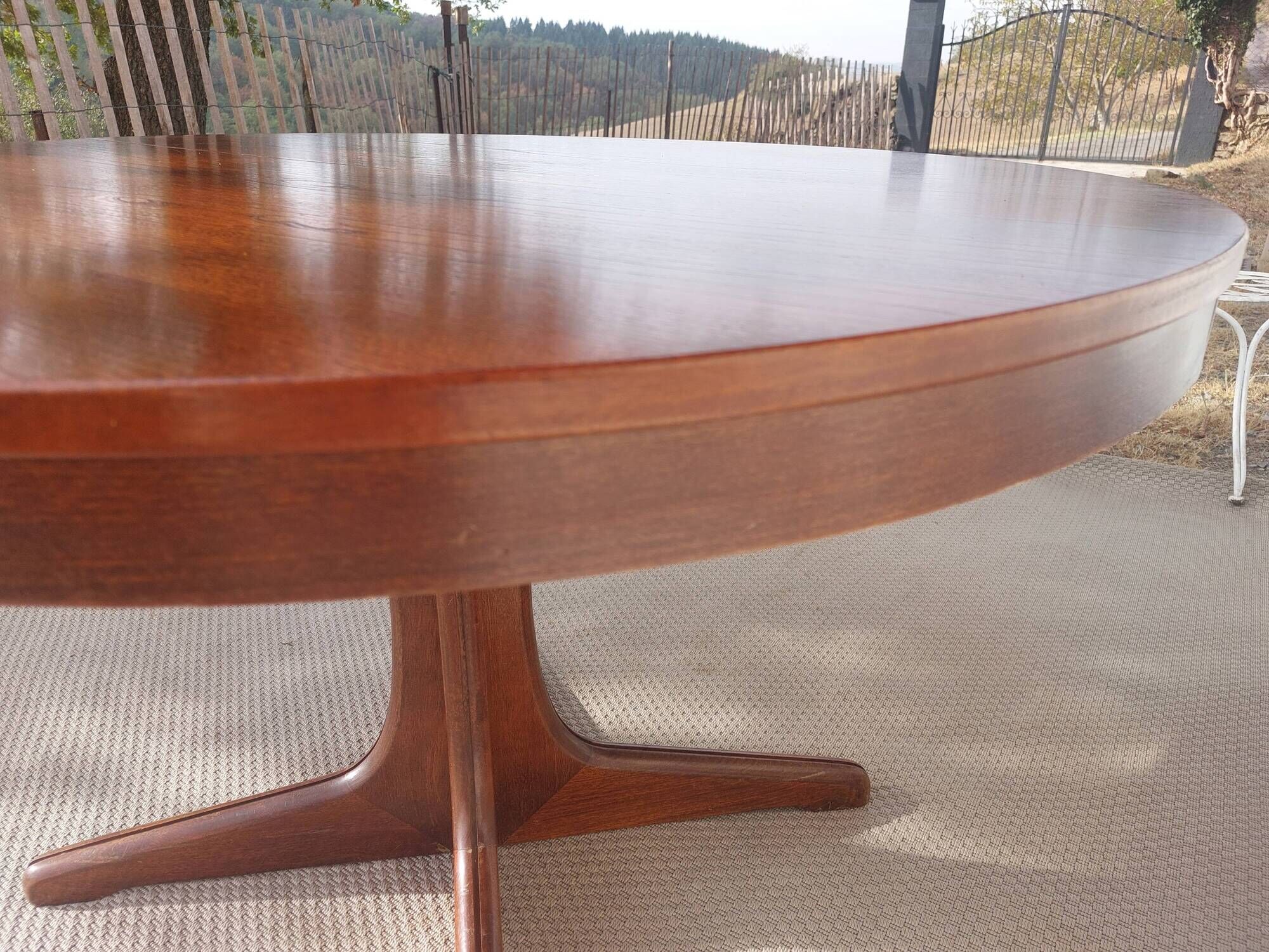 round/oval table with extension, central leg, dark shade, Baumann design