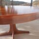 round/oval table with extension, central leg, dark shade, Baumann design