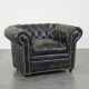 Spacious black cow leather chesterfield armchair with distinctive character