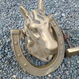 Horse head on horseshoe door knocker