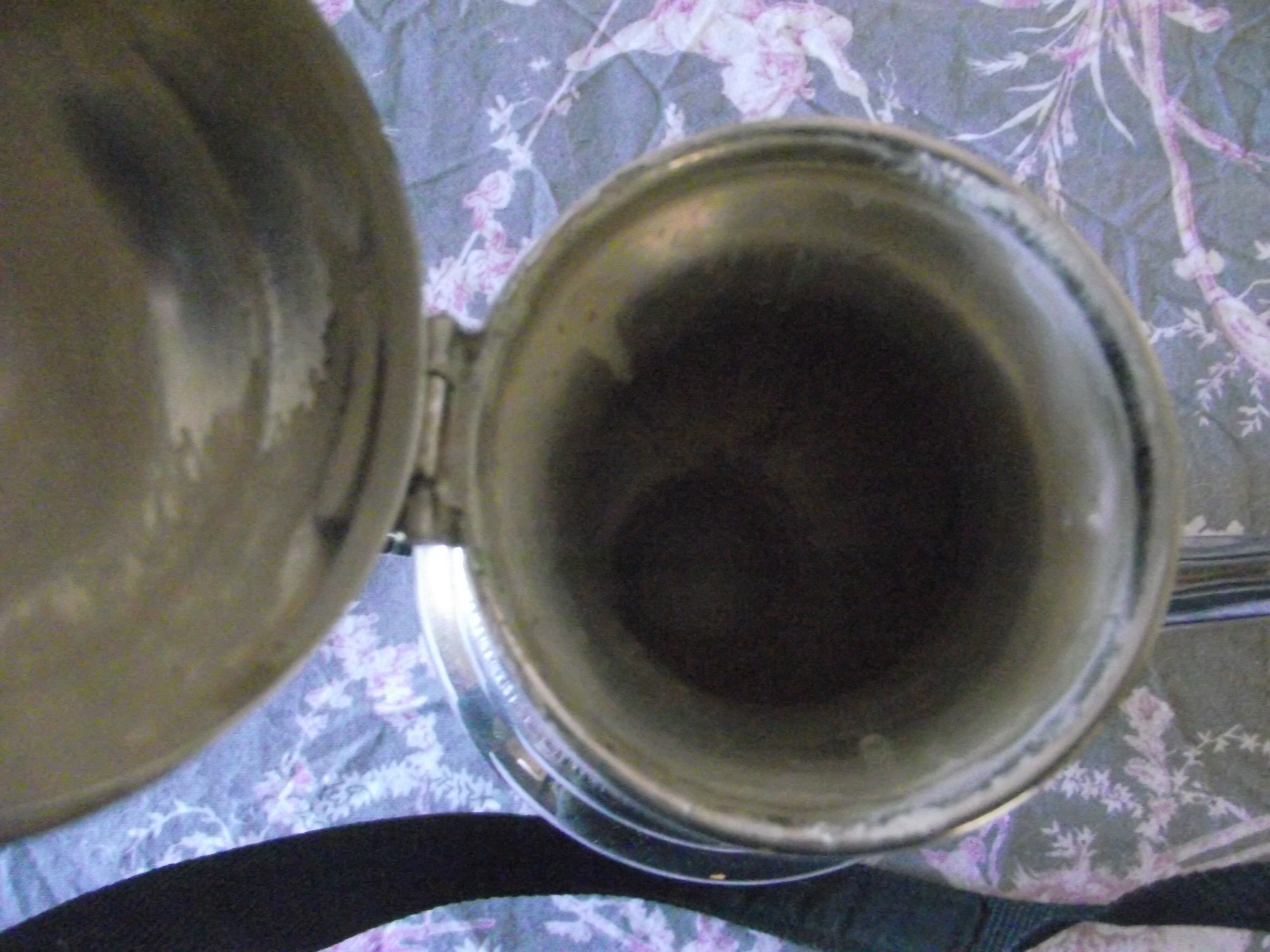Empire-style silver metal teapot.