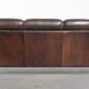 Set of a sheepskin sofa together with its matching club armchair