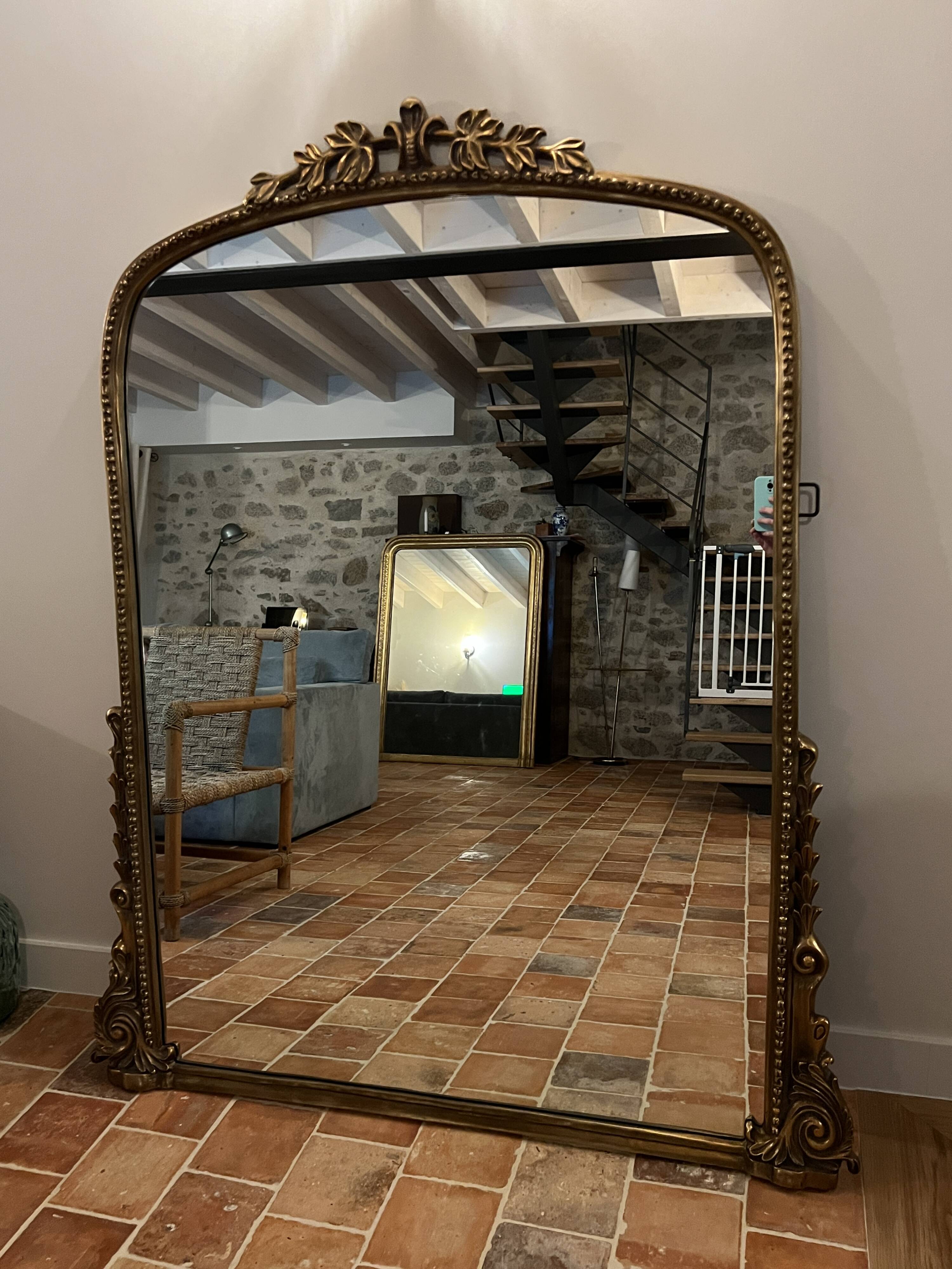 Large gilded mirror with pediment