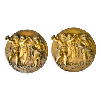 Pair of Italian bronze plaques, decorated with Puttis