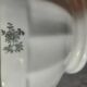 White earthenware bowl with decorative flowers