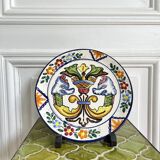 Decorative ceramic plate with griffins