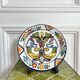 Decorative ceramic plate with griffins