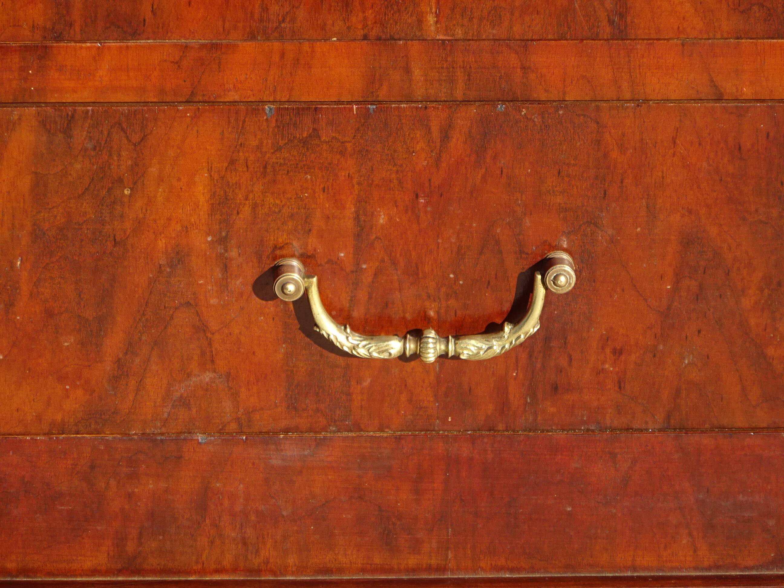 Antique mahogany chest of drawers with white marble.