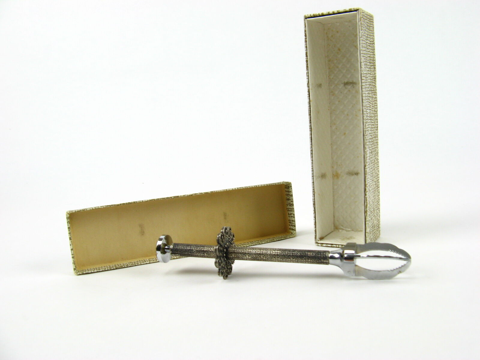 Sugar tongs in its case