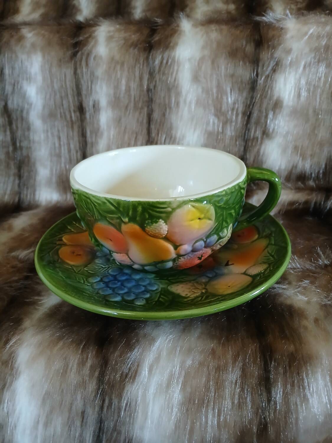 Antique cup and saucer in slipware.