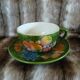 Antique cup and saucer in slipware.