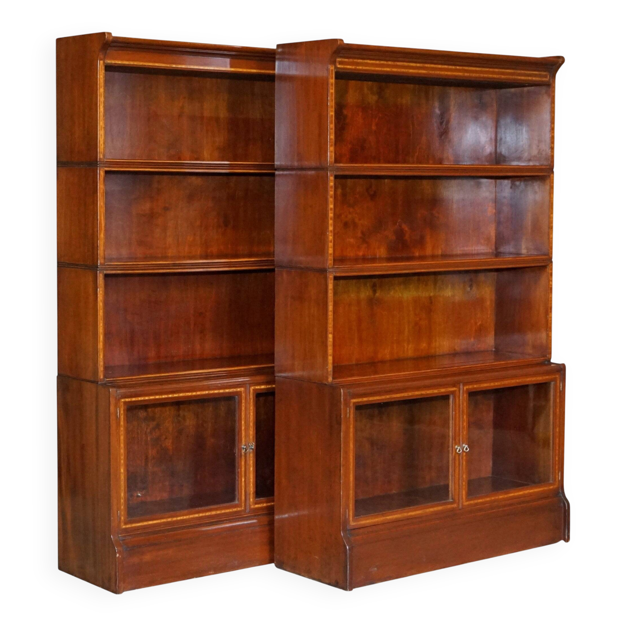 Antique pair of legal bookcases by William Baker Co in hardwood, satin and walnut.