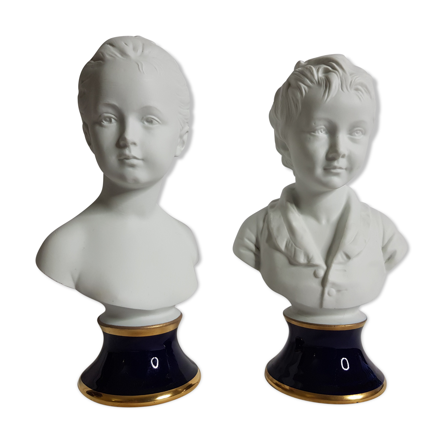 Porcelain biscuit busts by Camille Tharaud, children Louise and Alexandre Brongniart after Houdon