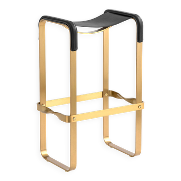 Contemporary classic bar stool with a vintage brass metal finish and black leather.